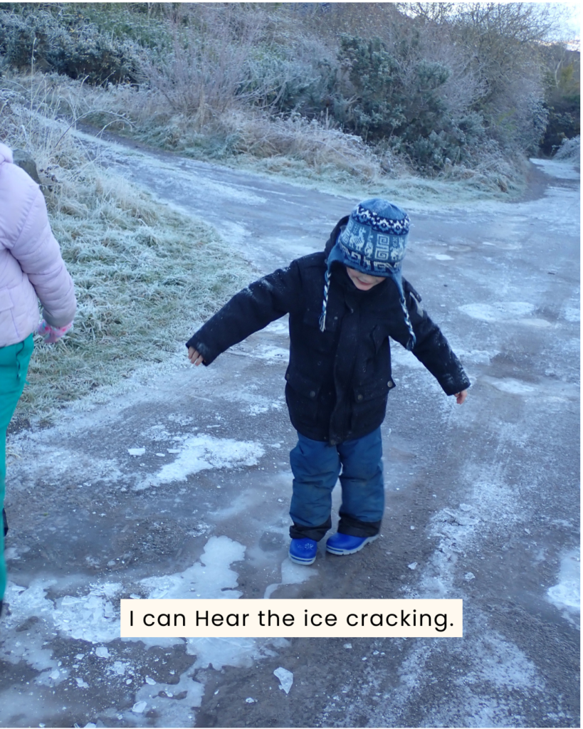 child playing in an ice puddle on a 5 senses nature walk
